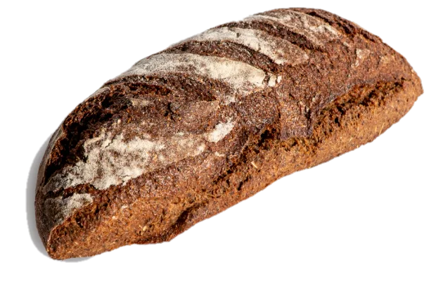 Okrugli crni raženi hleb, gusto posut brašnom, sa četiri kosa zareza.