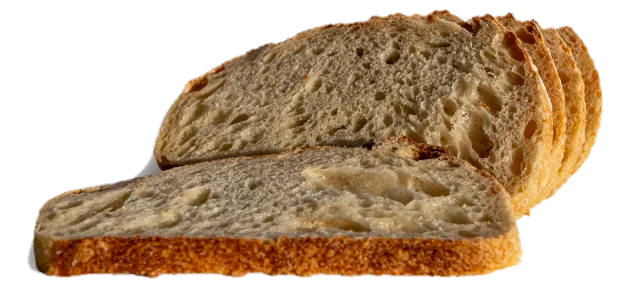Okrugao hleb Locus Sourdough, posut brašnom, sa zarezima u obliku klasa i tamnozlatnom korom.